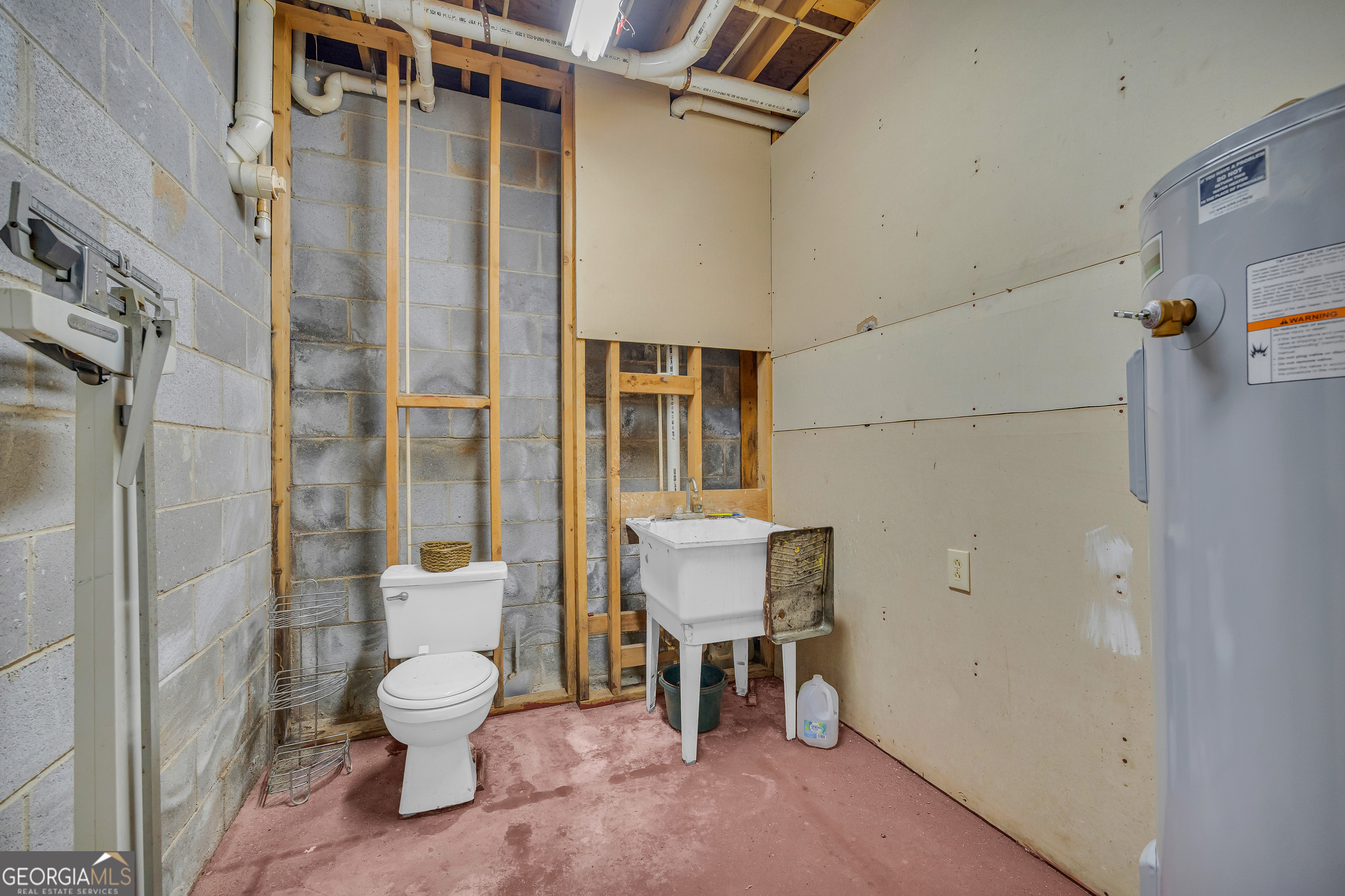 1640 Wire Bridge Road Watkinsville, GA 30677 - Photo 41 of 74 a white toilet sitting next to a bathroom