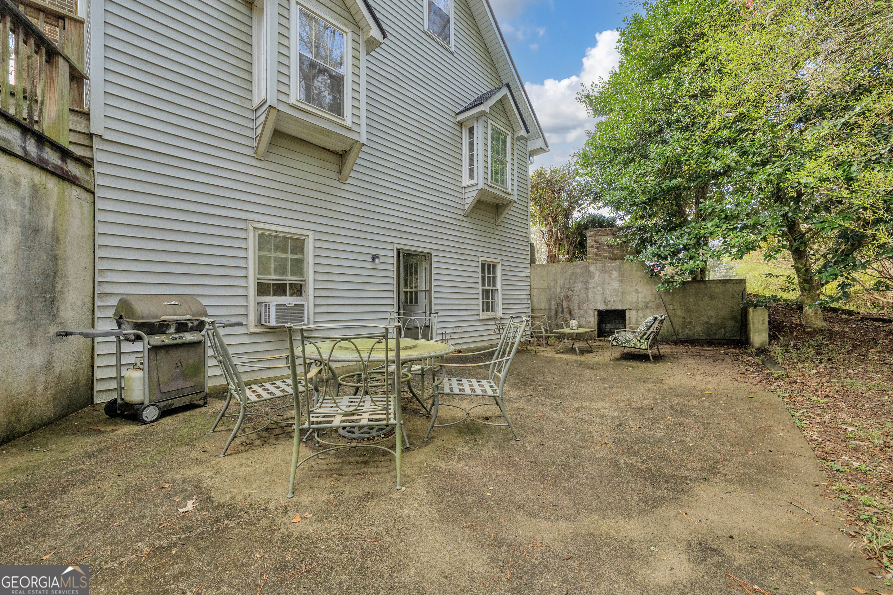 1640 Wire Bridge Road Watkinsville, GA 30677 - Photo 44 of 74 a view of a patio with table and chairs and potted plants