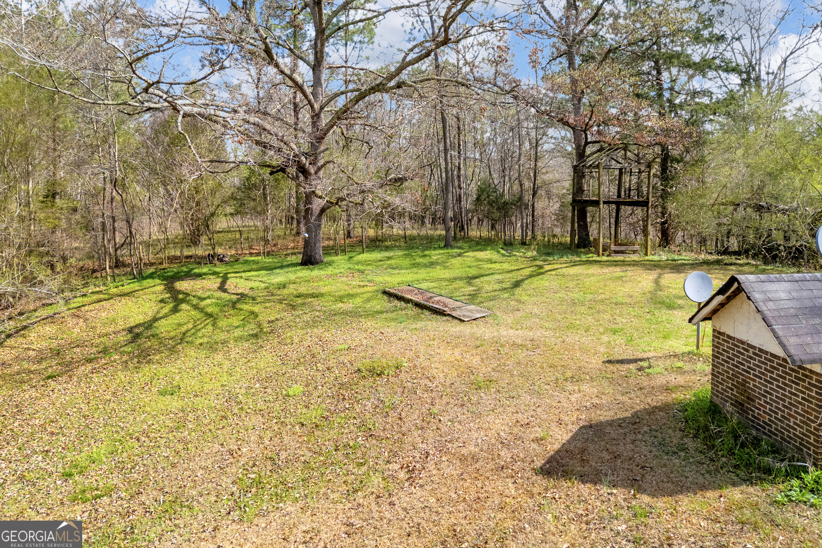 1640 Wire Bridge Road Watkinsville, GA 30677 - Photo 68 of 74 a view of a swimming pool with an outdoor space and seating area