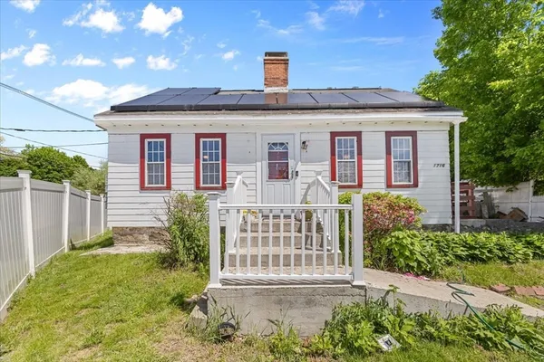 a front view of a house with a porch