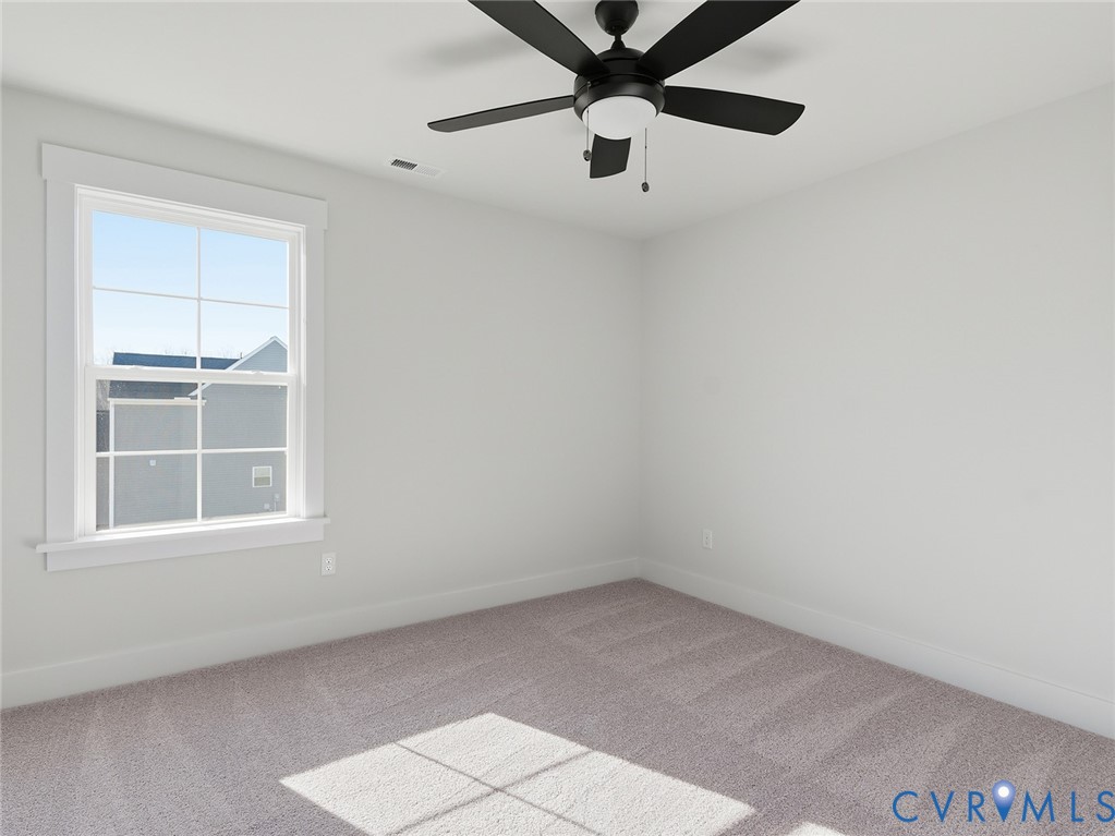 1711 Reed Marsh Lane Goochland, VA 23063 - Photo 15 of 25 an empty room with a window and a ceiling fan