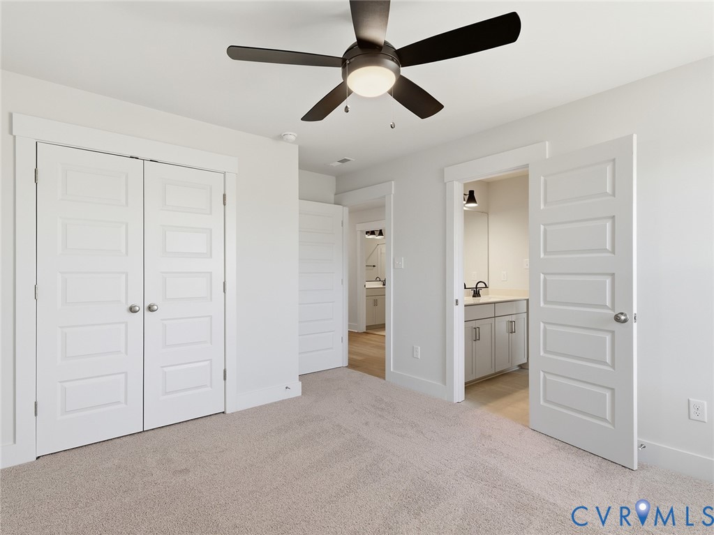 1711 Reed Marsh Lane Goochland, VA 23063 - Photo 18 of 25 an empty room with closet and a ceiling fan