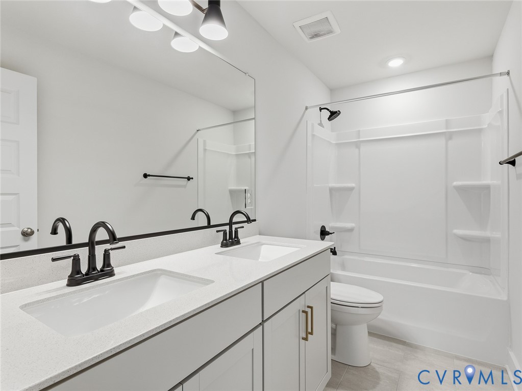1711 Reed Marsh Lane Goochland, VA 23063 - Photo 20 of 25 a bathroom with a sink vanity granite toilet tub and shower