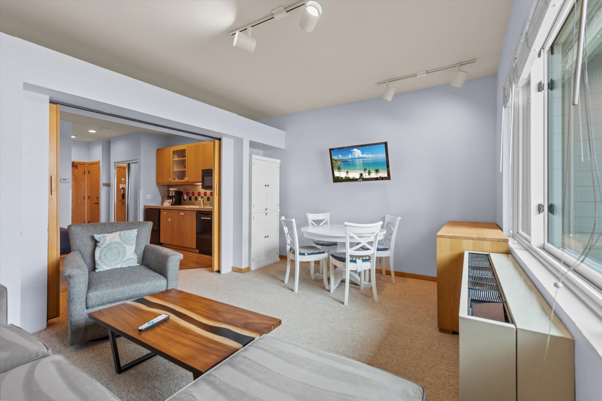201 Shirley Cyn Road, Unit 247 Olympic Valley, CA 96146 - Photo 2 of 27 a living room with furniture and a table
