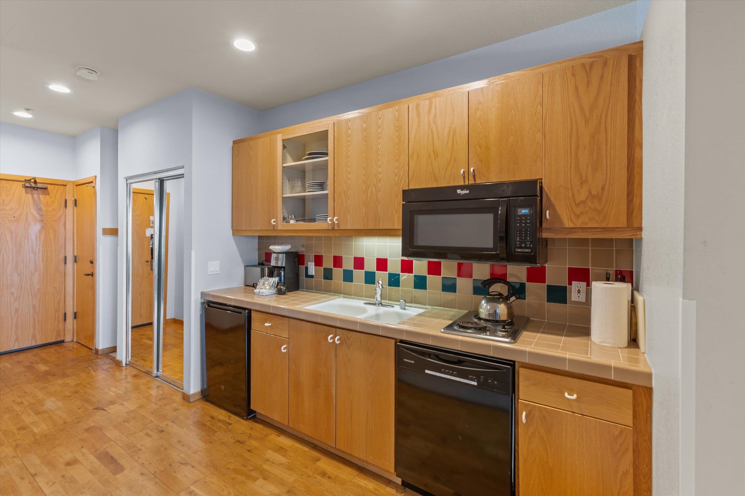 201 Shirley Cyn Road, Unit 247 Olympic Valley, CA 96146 - Photo 4 of 27 a kitchen with sink cabinets and microwave
