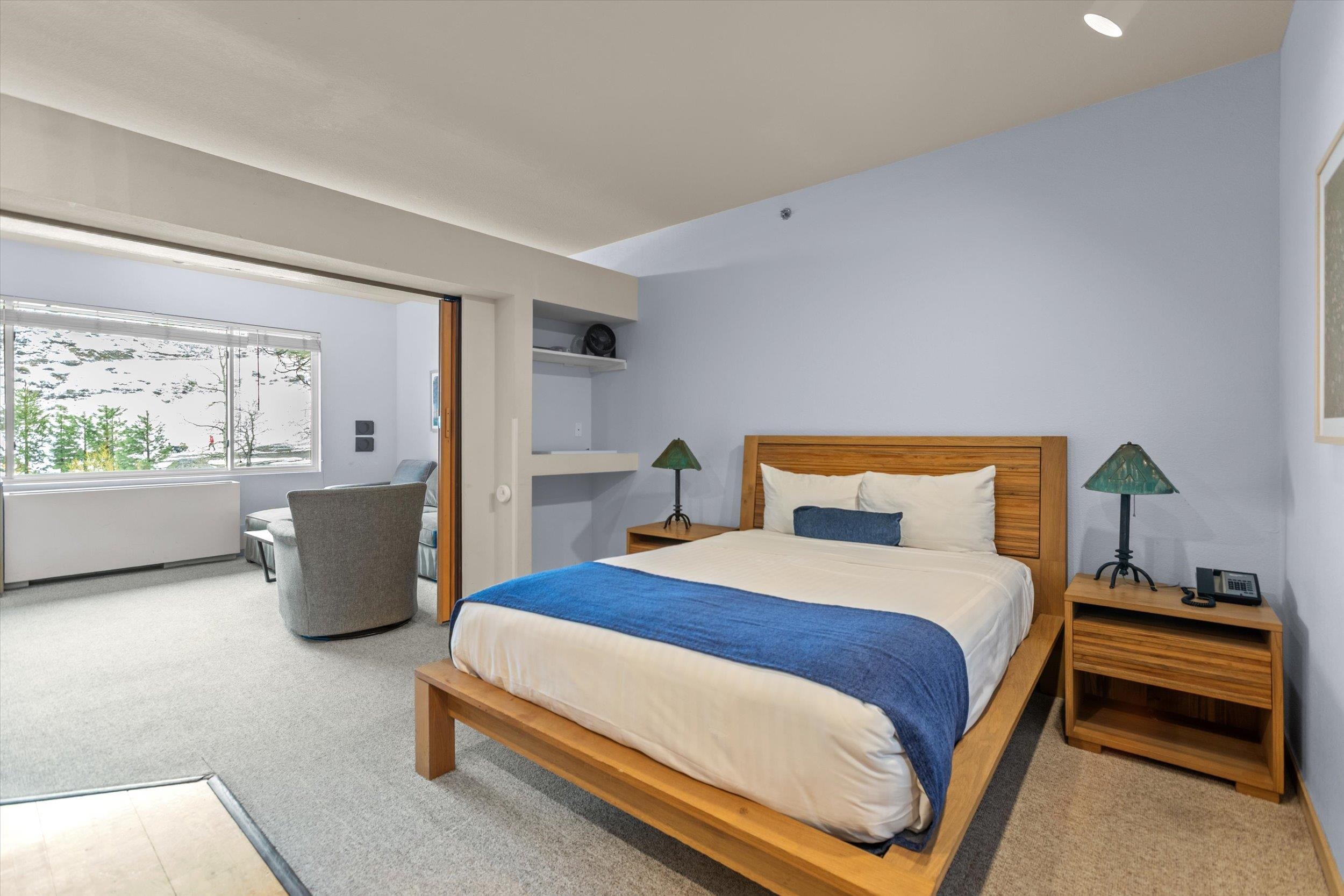 201 Shirley Cyn Road, Unit 247 Olympic Valley, CA 96146 - Photo 8 of 27 a bedroom with a bed and a couch