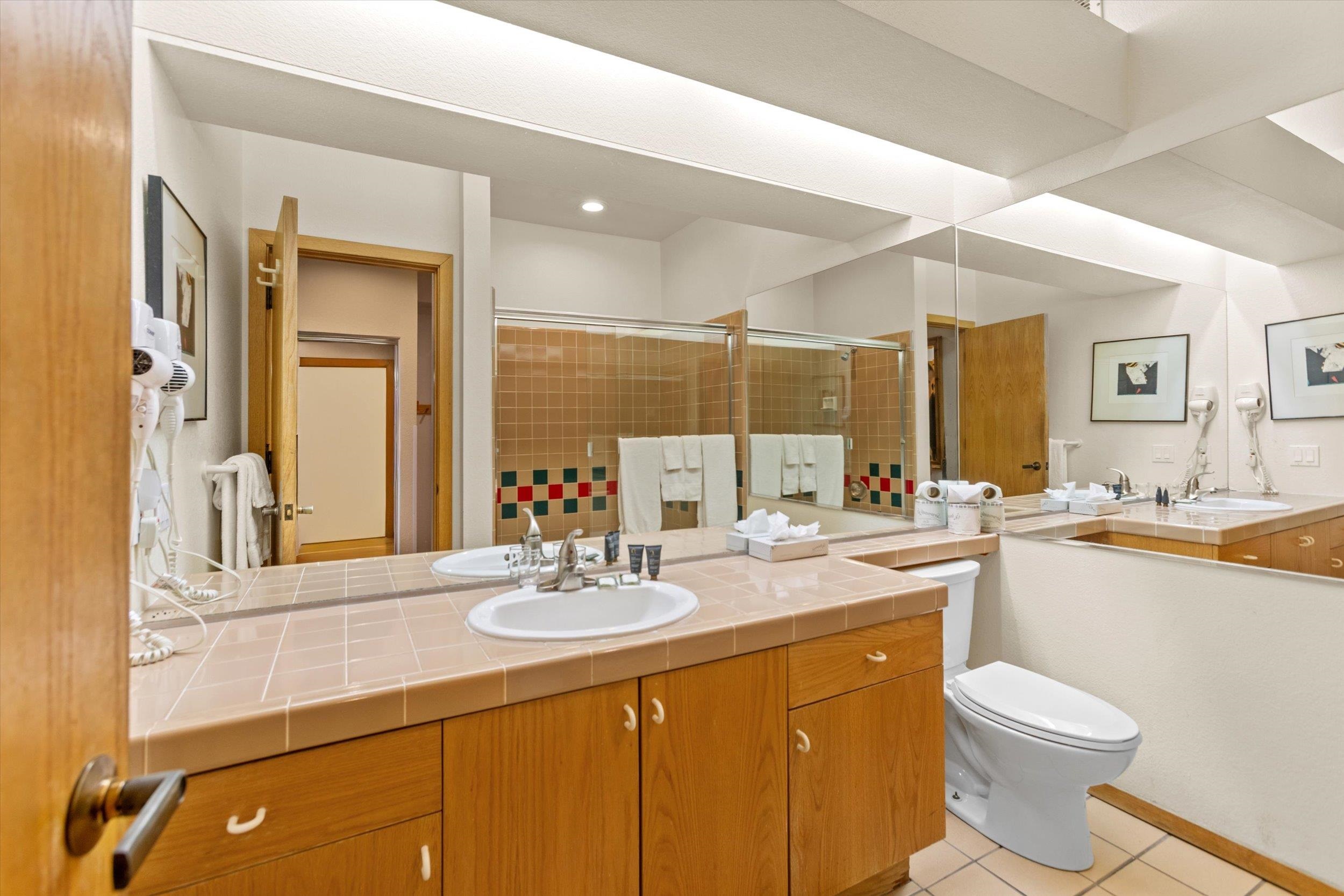 201 Shirley Cyn Road, Unit 247 Olympic Valley, CA 96146 - Photo 10 of 27 a bathroom with a double vanity sink mirror and toilet