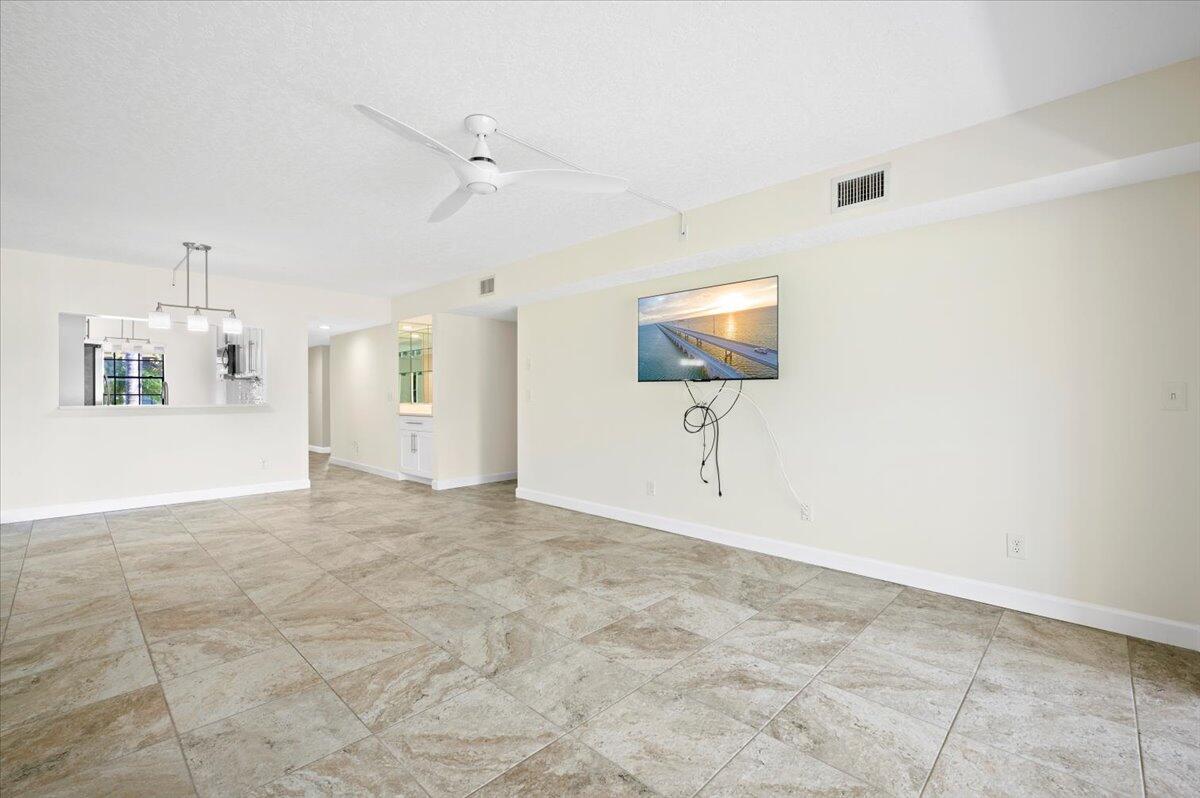 101 Pinecrest Circle, Unit A Jupiter, FL 33458 - Photo 8 of 25 a view of an empty room