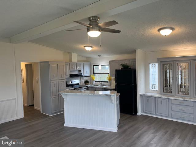 5186 Stone Terrace Drive Whitehall, PA 18052 - Photo 3 of 7 a kitchen with stainless steel appliances granite countertop a refrigerator a stove top oven a sink and dishwasher with wooden floor