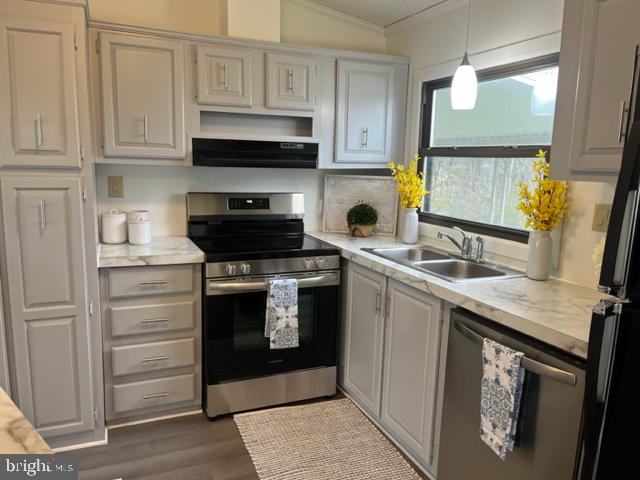 5186 Stone Terrace Drive Whitehall, PA 18052 - Photo 4 of 7 a kitchen with stainless steel appliances white cabinets and a stove top oven