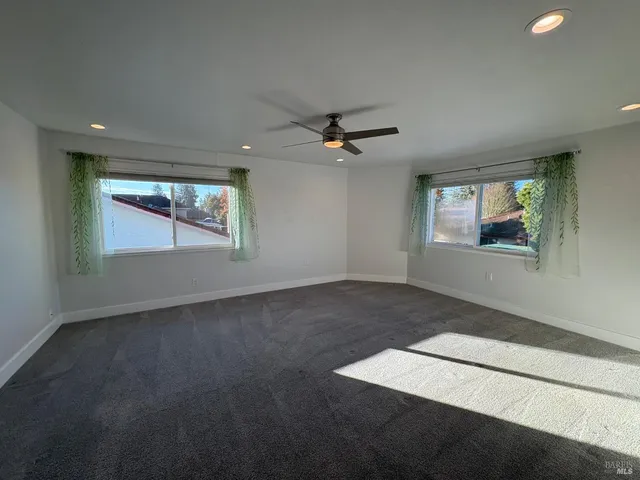 a bathroom with a mirror sink and vanity
