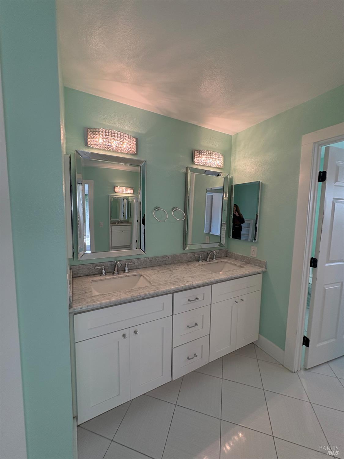 5705 Davis Circle Rohnert Park, CA 94928 - Photo 35 of 46 a spacious bathroom with a granite countertop sink and a mirror