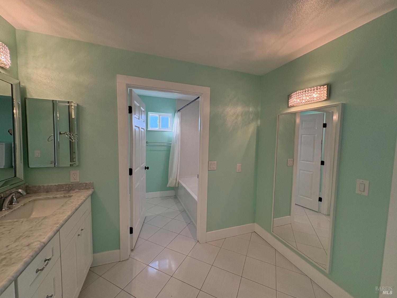 5705 Davis Circle Rohnert Park, CA 94928 - Photo 43 of 46 a spacious bathroom with a mirror sink and shower