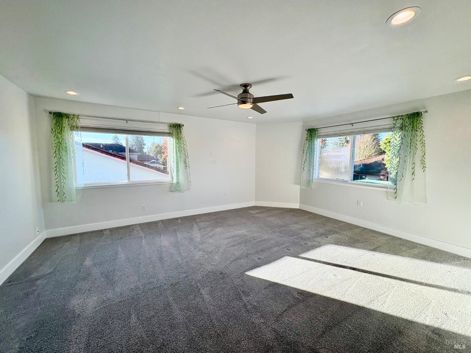 5705 Davis Circle Rohnert Park, CA 94928 - Photo 45 of 46 an empty room with windows and ceiling fan