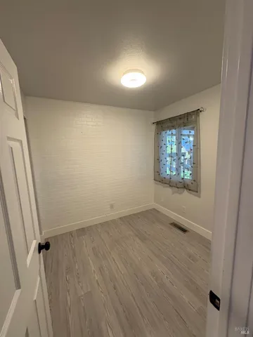 a kitchen with a cabinets and a stove top oven