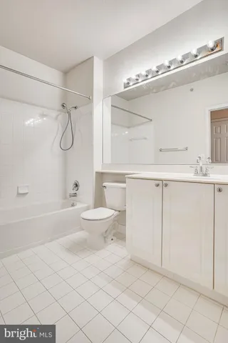 a bathroom with a sink vanity and a mirror