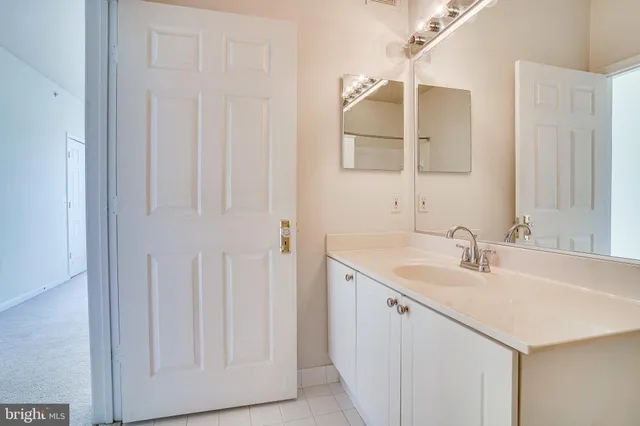 a bathroom with a bath tub with a shower
