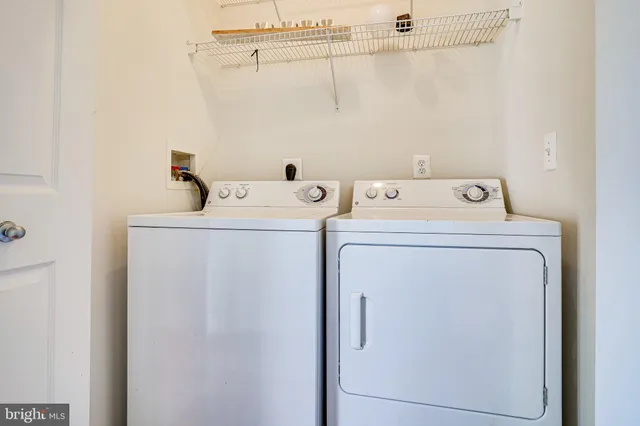 a view of a storage & utility room with wooden floor