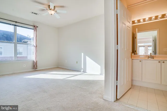 a view of a house with backyard and deck