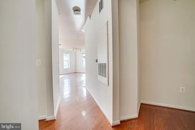 a living room with furniture and large windows