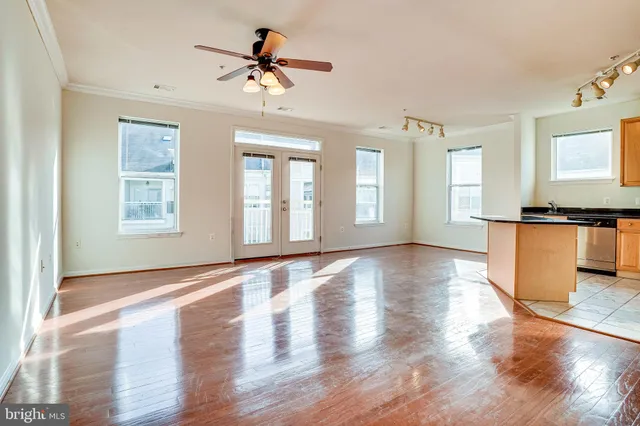 a view of a kitchen with a stove cabinets and wooden floor