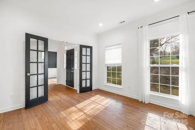 a view of a workspace with furniture and a potted plant