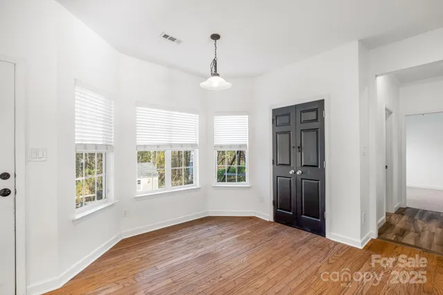 a kitchen with a refrigerator and a stove top oven
