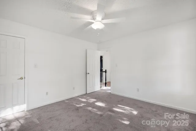 a view of empty room with windows