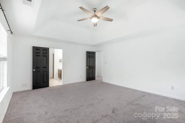 a bathroom with a double vanity sink a mirror and a shower