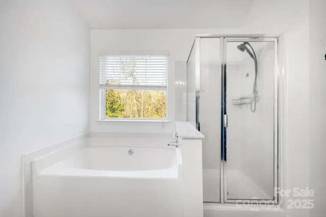 a view of walk in closet with window