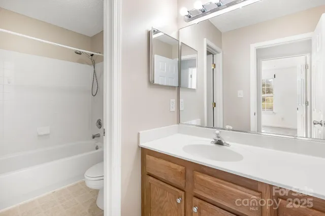 an empty room with a fan