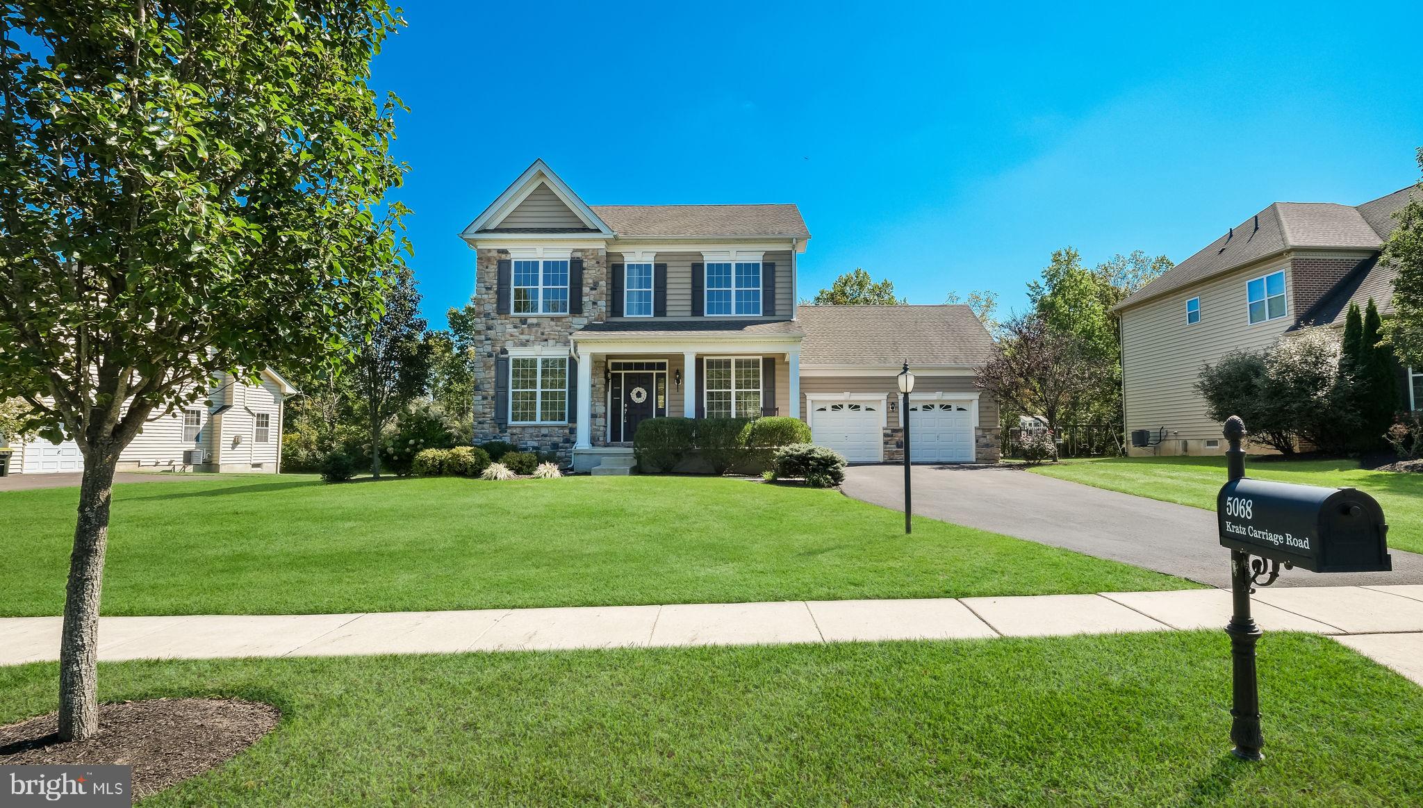5068 Kratz Carriage Road Pipersville, PA 18947 - Photo 2 of 52 a front view of a house with a yard