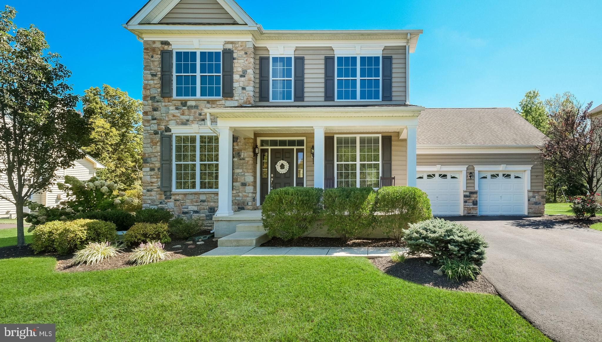 5068 Kratz Carriage Road Pipersville, PA 18947 - Photo 3 of 52 a front view of a house with a yard