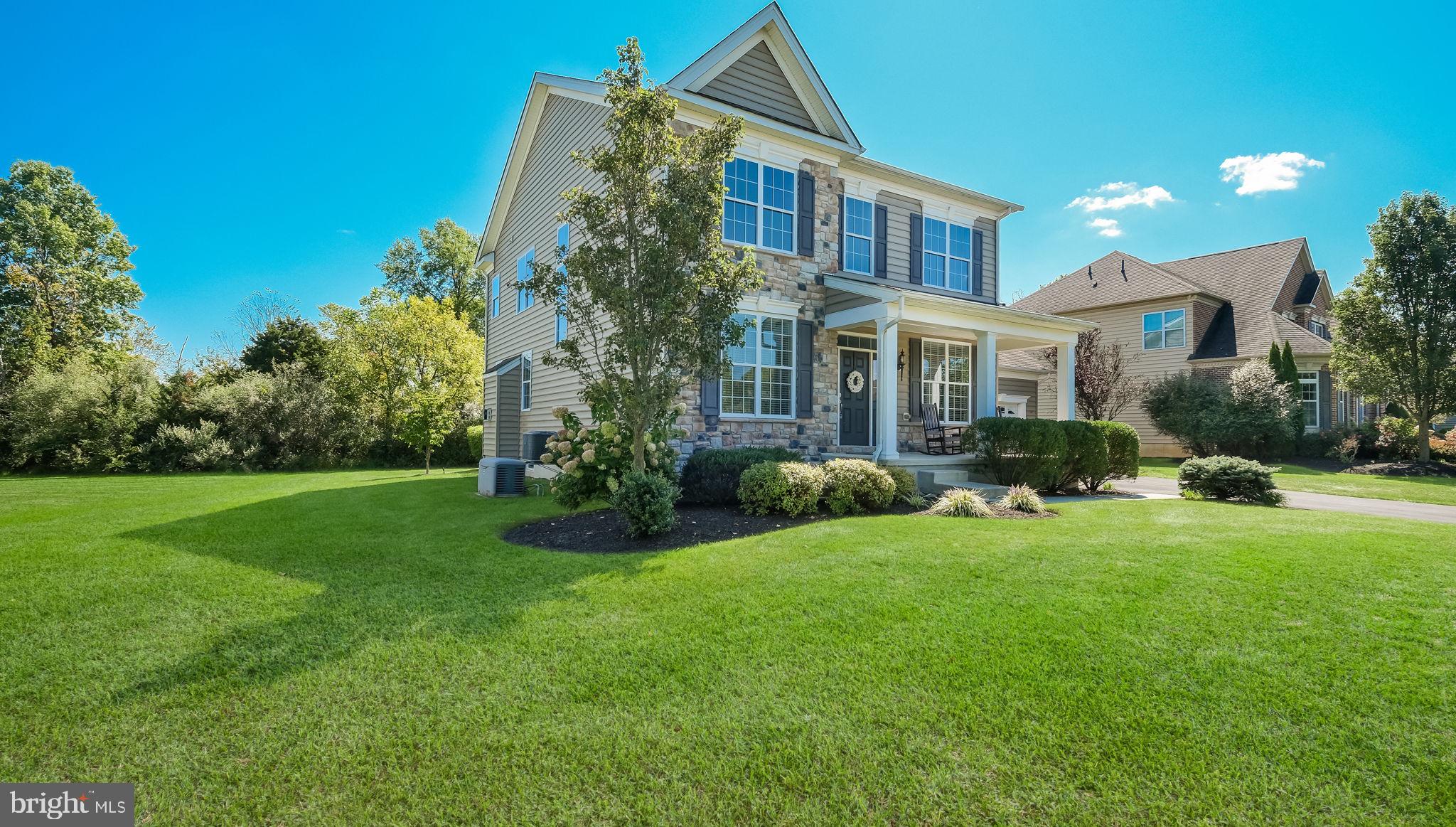 5068 Kratz Carriage Road Pipersville, PA 18947 - Photo 4 of 52 a view of a house with a yard and plants