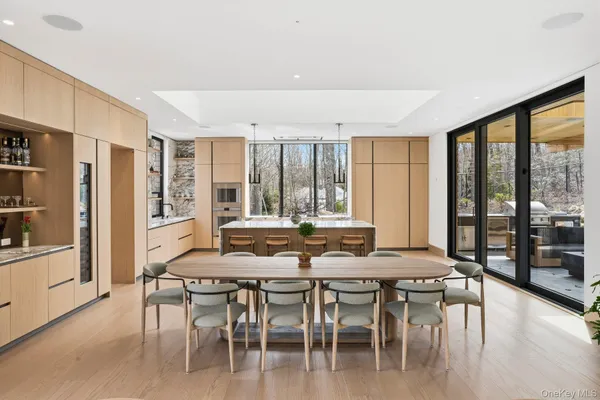 a dining room with furniture and wooden floor