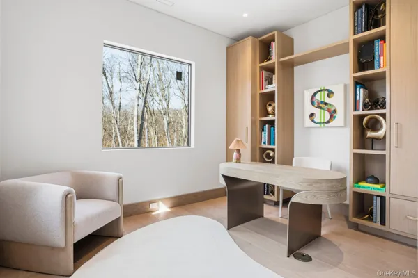 a workspace with furniture and window