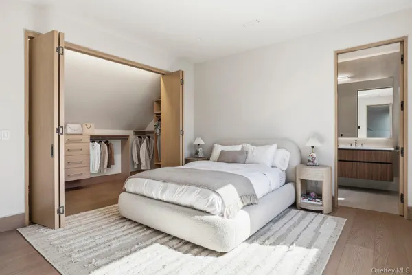 a large white bed in a white room
