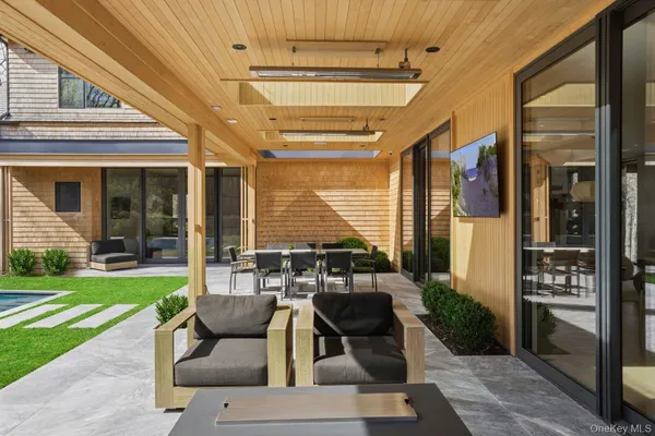 a patio with yard table and chairs