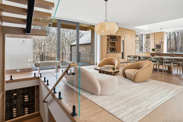 a spacious bedroom with a large bed and a chandelier