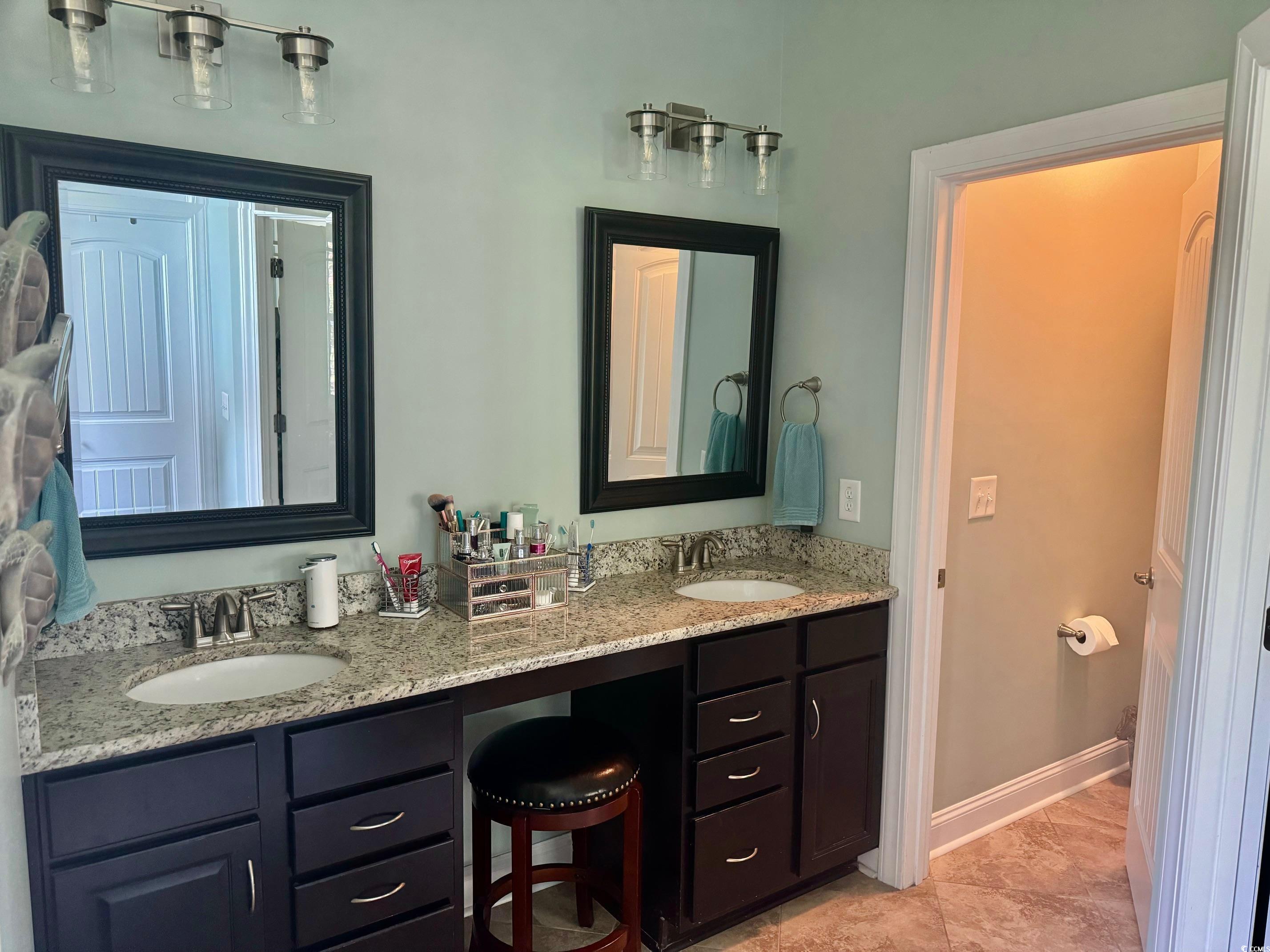 1592 Buckingham Avenue Myrtle Beach, SC 29577 - Photo 15 of 37 Bathroom featuring double sink vanity, ceramic til