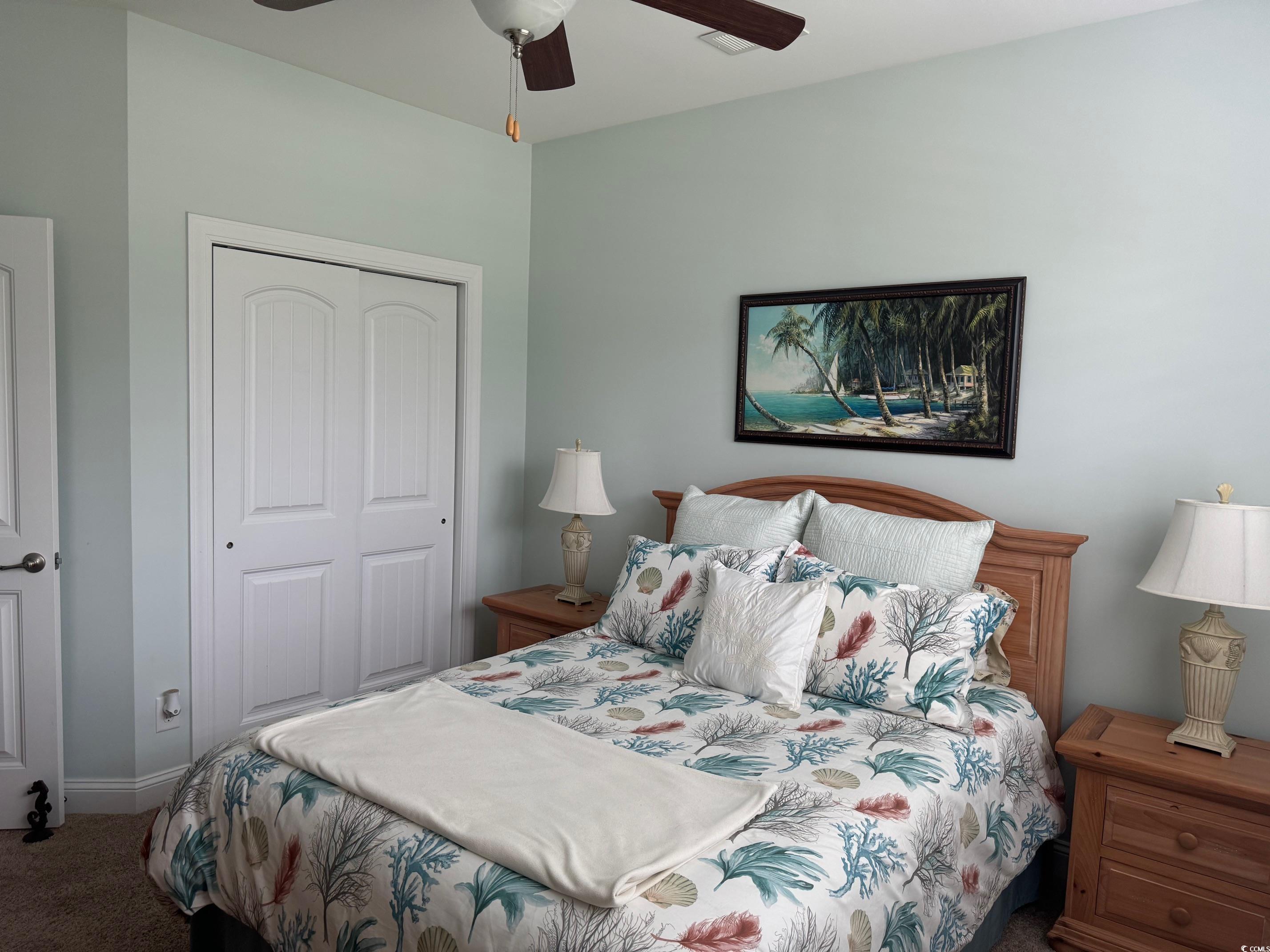 1592 Buckingham Avenue Myrtle Beach, SC 29577 - Photo 18 of 37 Carpeted bedroom featuring ceiling fan and a close