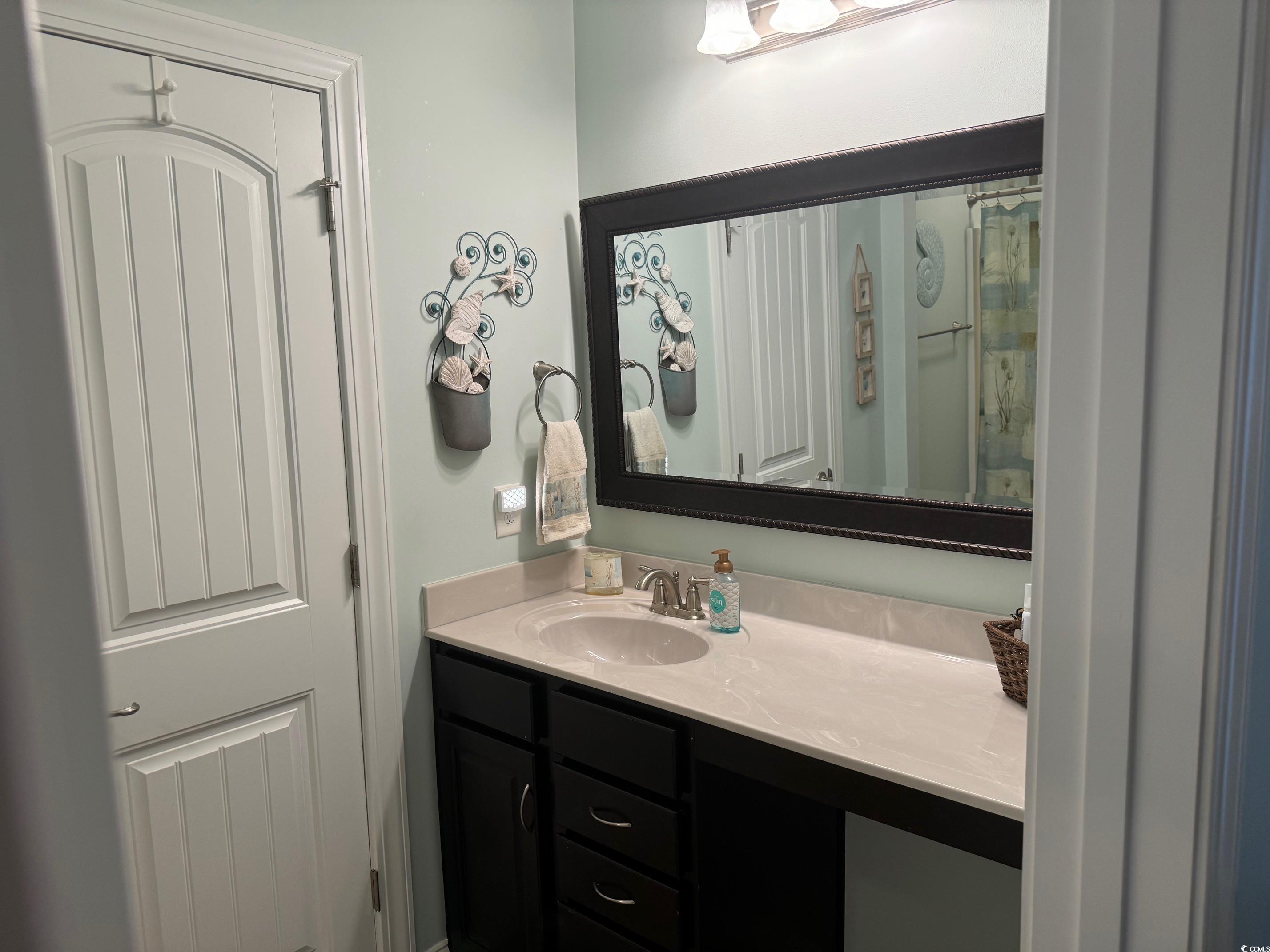 1592 Buckingham Avenue Myrtle Beach, SC 29577 - Photo 19 of 37 Bathroom with vanity and ceramic tile flooring