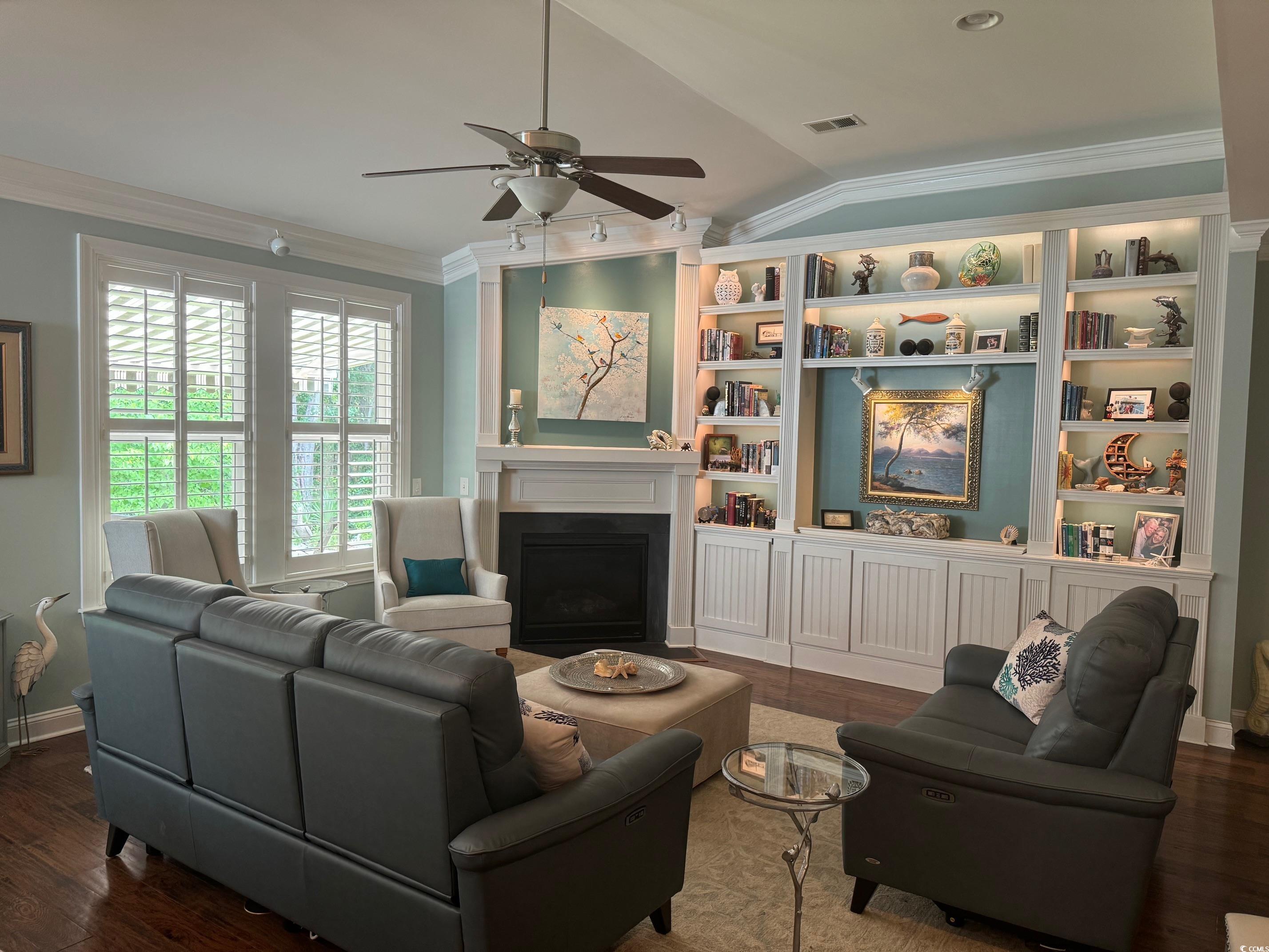1592 Buckingham Avenue Myrtle Beach, SC 29577 - Photo 2 of 37 Living room featuring ceiling fan, dark hardwood /