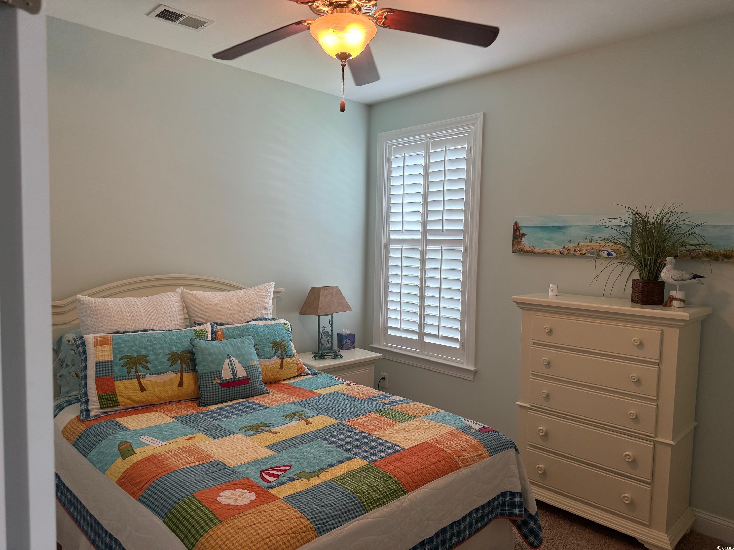 1592 Buckingham Avenue Myrtle Beach, SC 29577 - Photo 21 of 37 Bedroom featuring ceiling fan and multiple windows