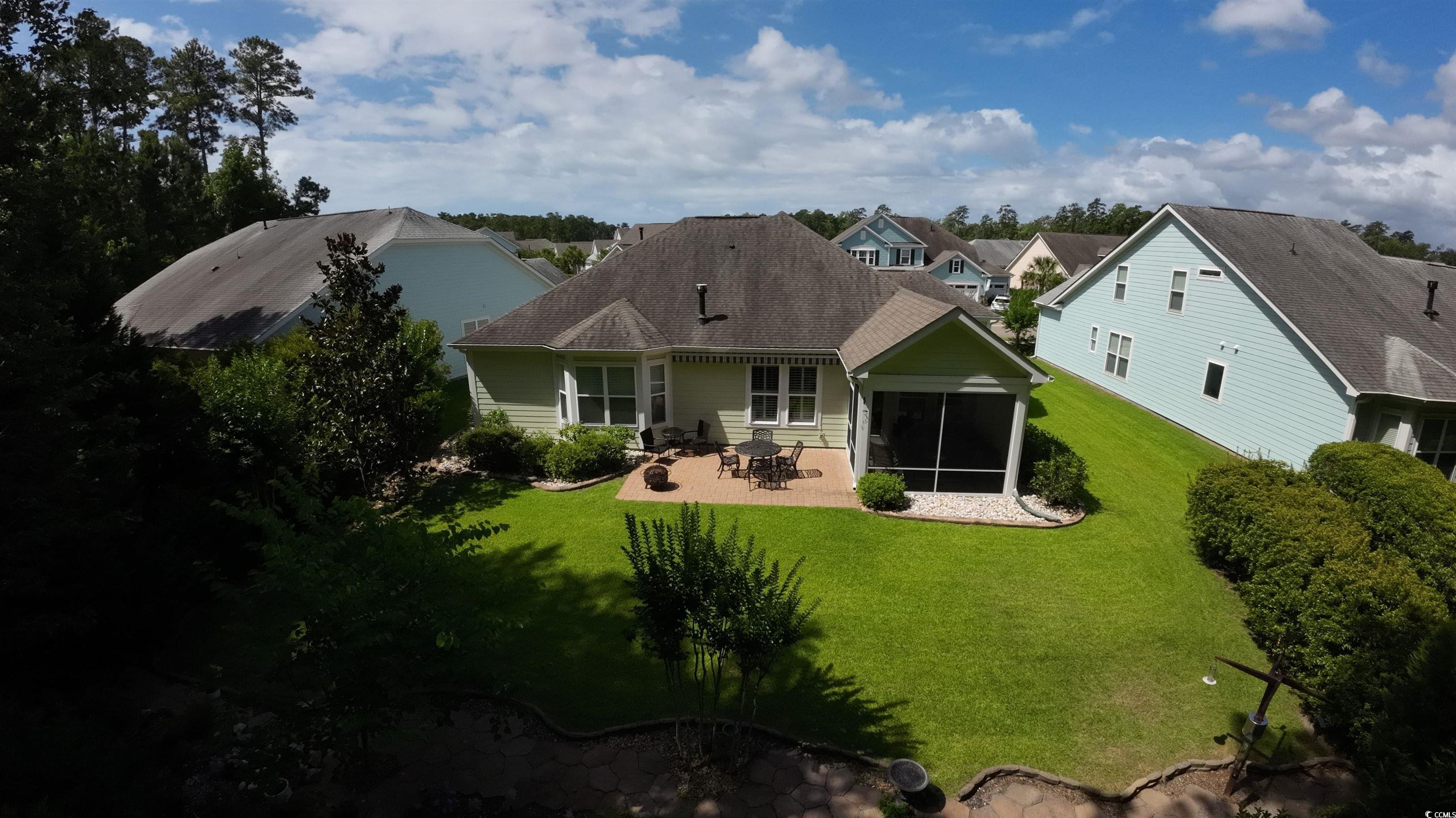 1592 Buckingham Avenue Myrtle Beach, SC 29577 - Photo 3 of 37 Rear view of house with a sunroom, a patio area, a