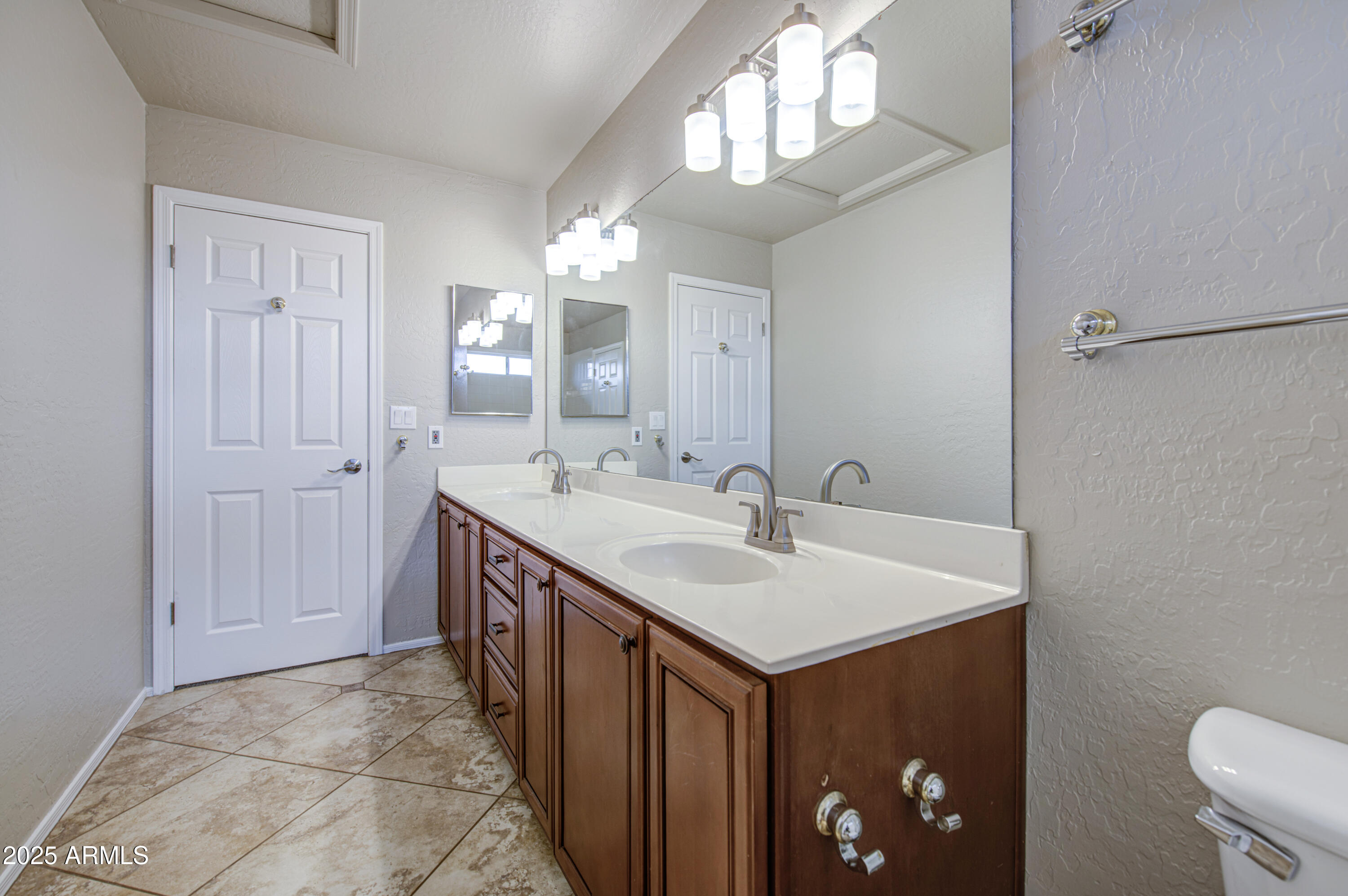16237 South 13th Street Phoenix, AZ 85048 - Photo 11 of 68 a bathroom with a sink and a mirror