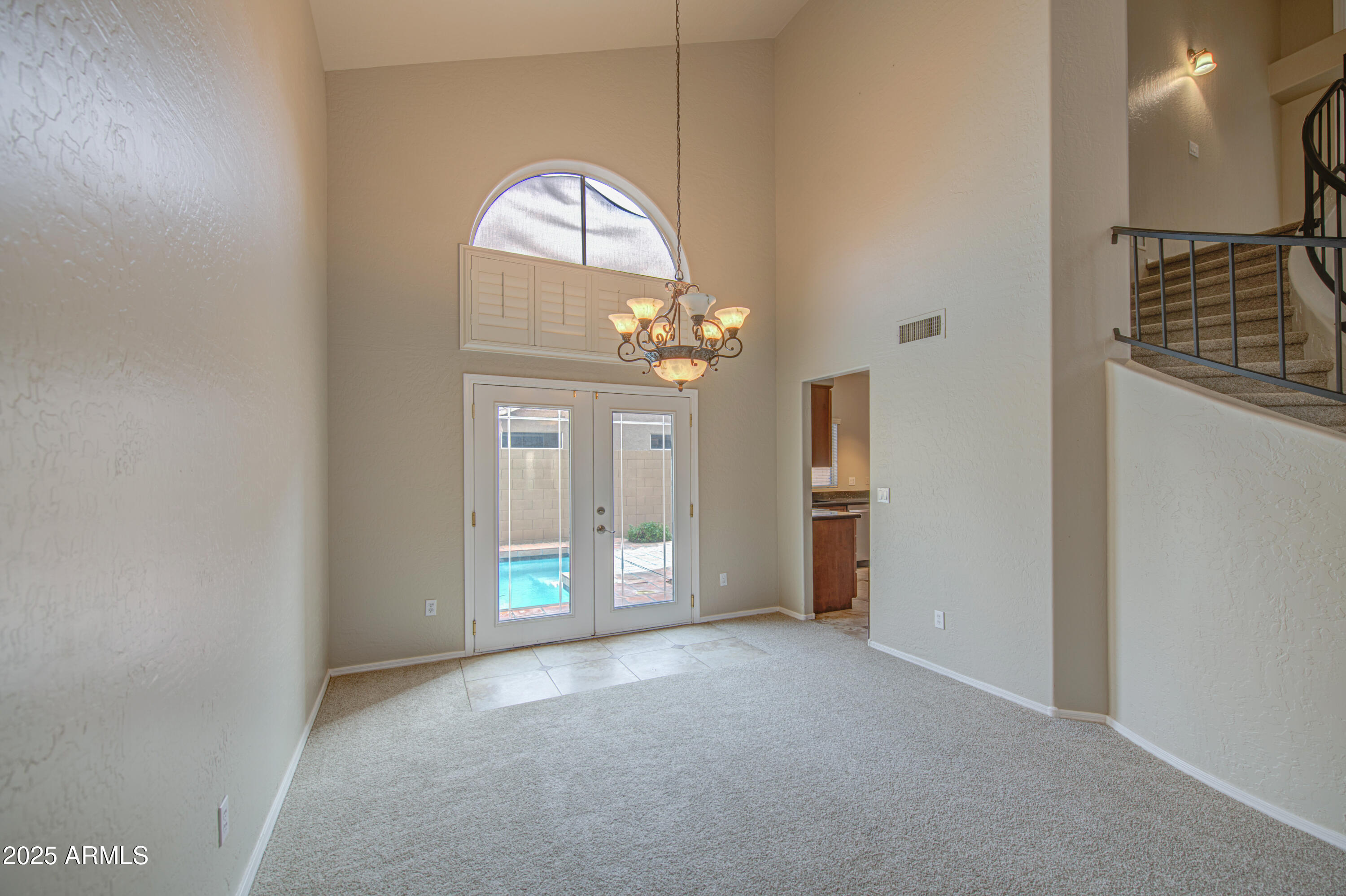 16237 South 13th Street Phoenix, AZ 85048 - Photo 19 of 68 a view of a livingroom with a chandelier