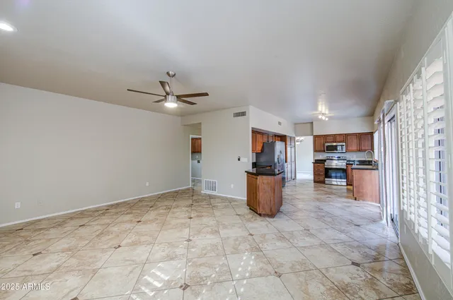a kitchen with stainless steel appliances granite countertop a sink stove and microwave