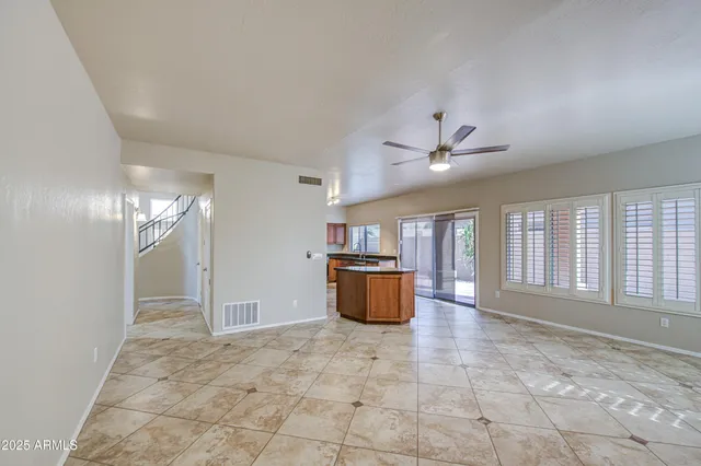 a kitchen with stainless steel appliances granite countertop a refrigerator and a stove