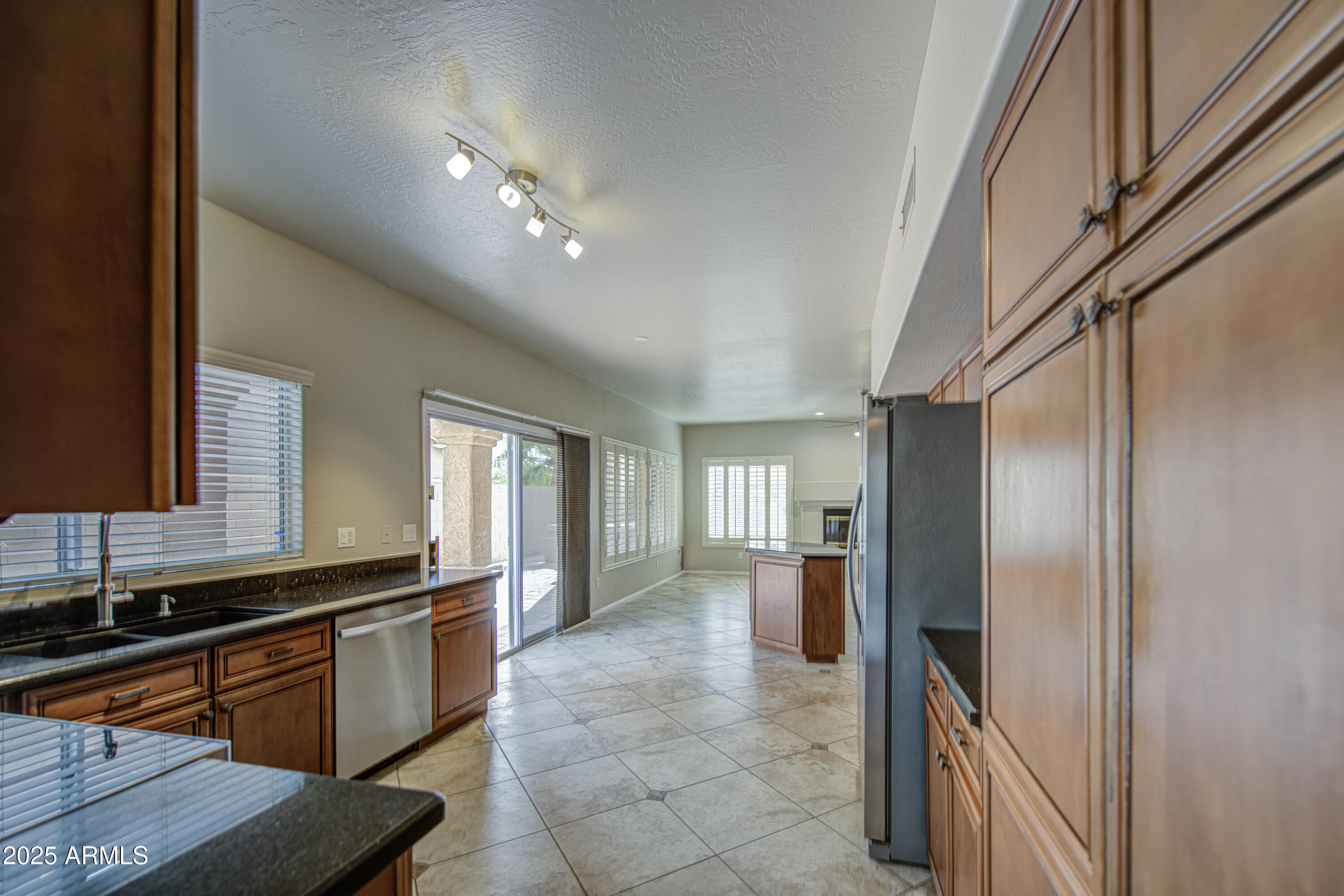 16237 South 13th Street Phoenix, AZ 85048 - Photo 28 of 68 a kitchen with stainless steel appliances granite countertop a refrigerator and a sink